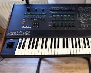 Oberheim Matrix 12 analog synthesizer with 12-voice polyphony and advanced modulation features for versatile sound design.