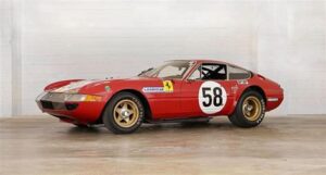 Front view of the Ferrari 250 LM, the 1965 Le Mans-winning race car, restored to its original specifications, showcasing its sleek design.