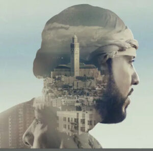 “French Montana on the One More Chance album cover, standing under a dramatic cityscape, illuminated by glowing streetlights.”