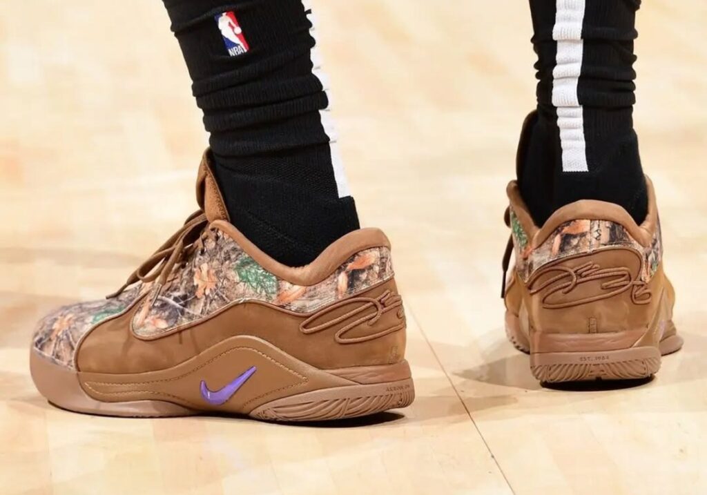 Nike LeBron 22 “Realtree Camo” PE sneakers featuring a camouflage pattern, bright orange accents, and premium materials.