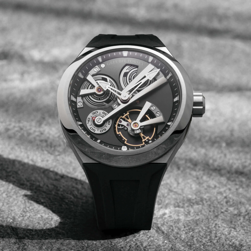Greubel Forsey Double Balancier Convexe in 42.5mm black carbon, showcasing twin balance wheels and a skeletonized dial.