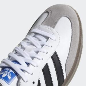 Adidas Samba OG sneakers styled in a modern NYC streetwear look with cropped trousers and oversized outerwear.