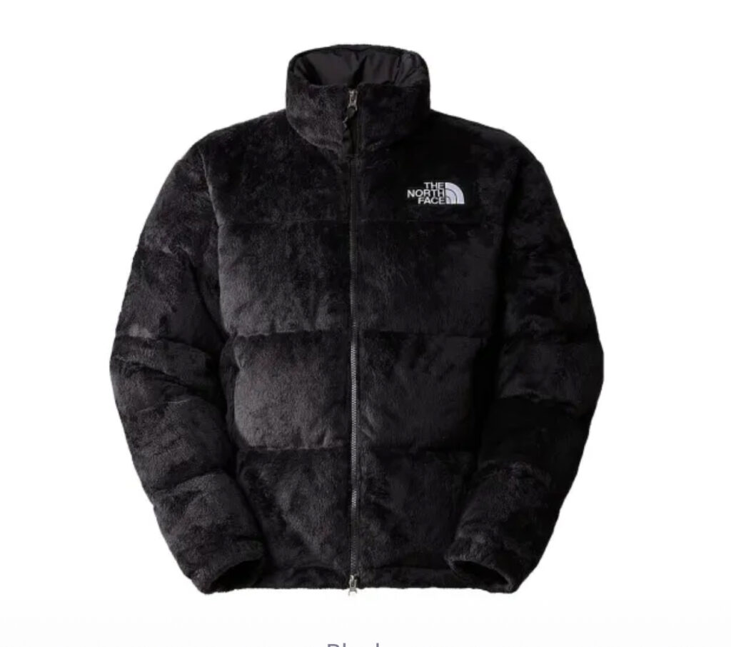 A close-up of The North Face Versa Velour Nuptse Jacket, showcasing its velour fabric, boxy silhouette, and premium insulation.