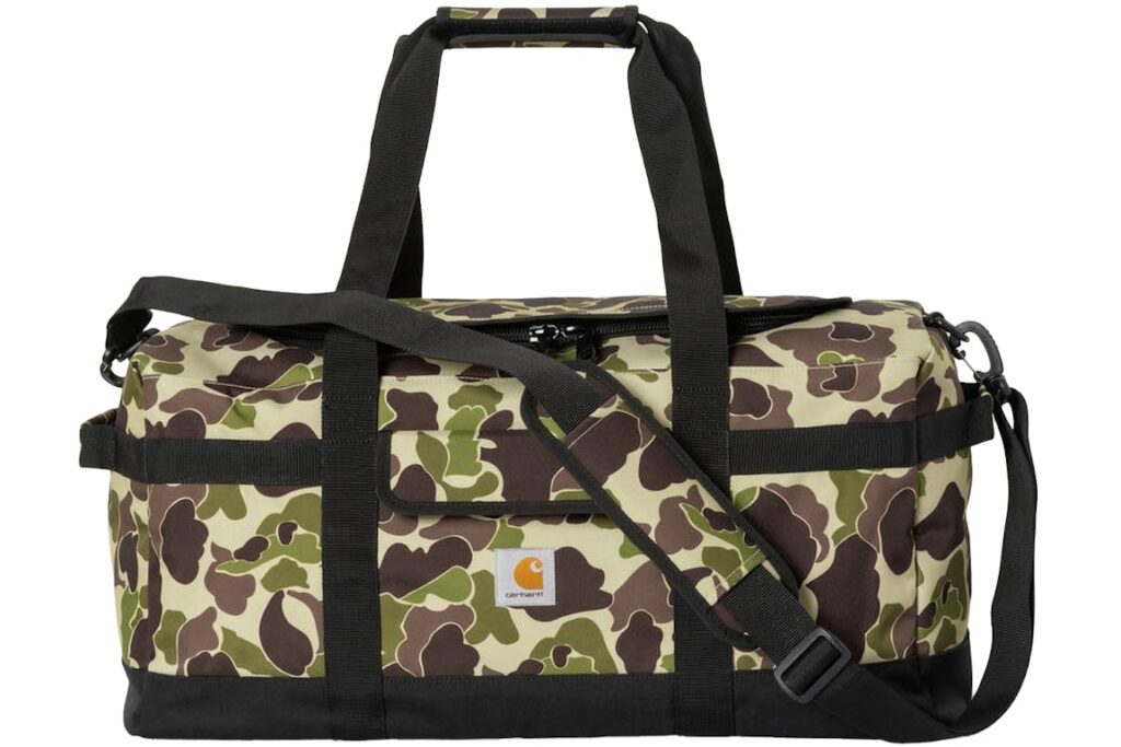 A stylish Carhartt WIP Jack Duffle Bag in Green Camo Duck print, featuring durable canvas material and functional design.