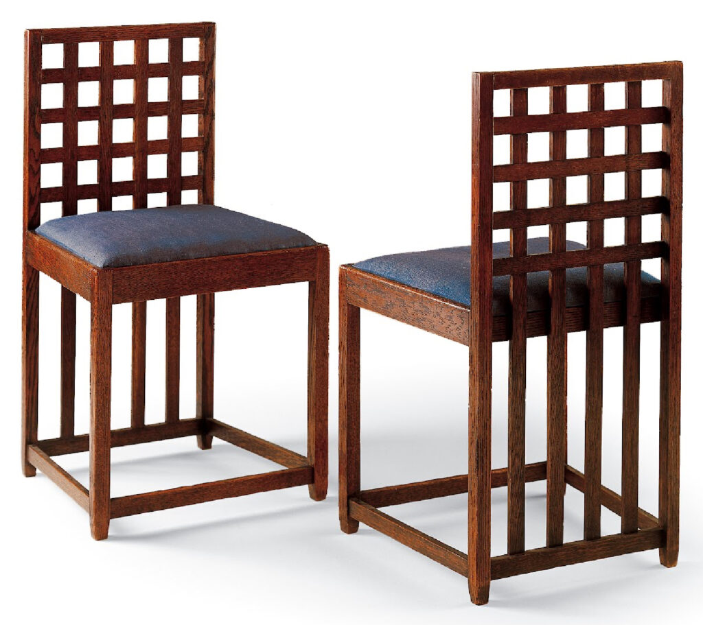 Two oak and linen chairs by Charles Rennie Mackintosh for the Blue Bedroom at Hous’hill, showcasing elegant simplicity.