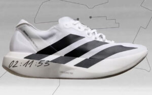 A sleek Adidas ultra-flat sneaker with a minimalist silhouette, featuring updated materials and vibrant color accents. 