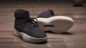 Jerry Lorenzo holding Fear of God ATHLETICS basketball shoes, showcasing minimalist design and performance innovation