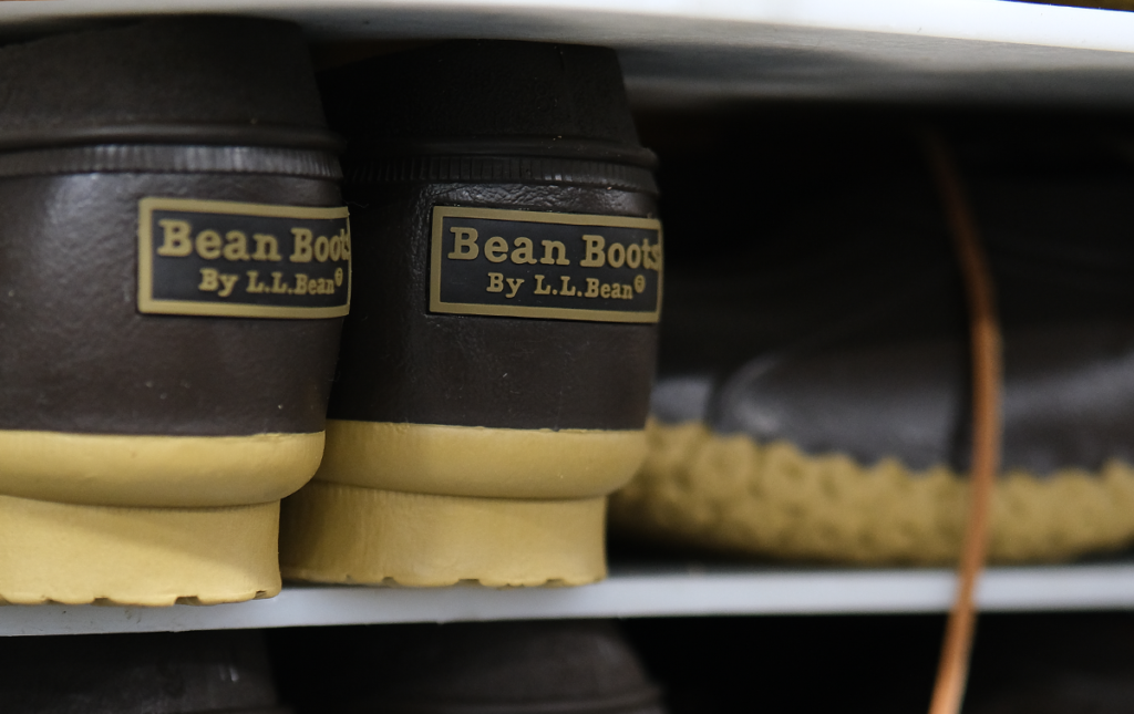 Close-up of L.L.Bean Bean Boots showcasing waterproof rubber soles and leather uppers, crafted for durability and style