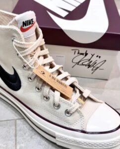 A Ma Maniére x Converse Chuck 70 sneakers with premium canvas, Nike Swoosh logo, and minimalist monochromatic design