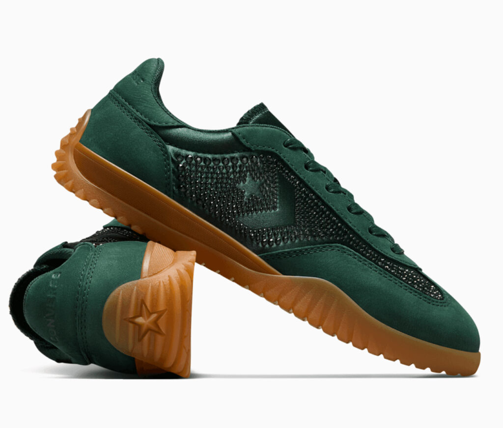 A pair of Swarovski x Converse Run Star trainers in Deep Emerald, featuring a satin and suede upper adorned with Swarovski crystals, a chunky platform sole, and a translucent gum outsole, blending luxury and streetwear style