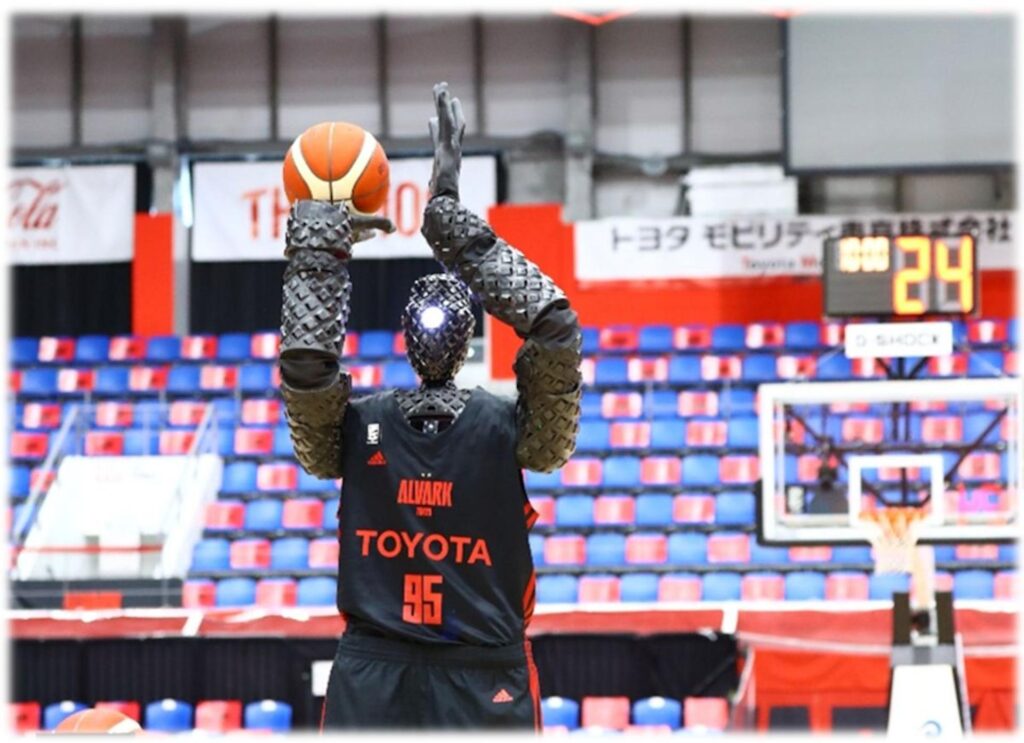 Toyota’s humanoid basketball robot CUE making an 80-foot shot on a court, showcasing precision engineering and AI technology