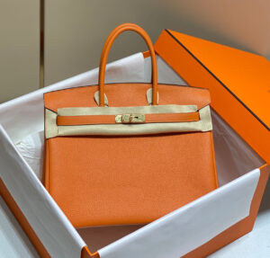 Close-up of an artisan handcrafting a Hermès Birkin bag, showcasing meticulous stitching and luxurious leather materials