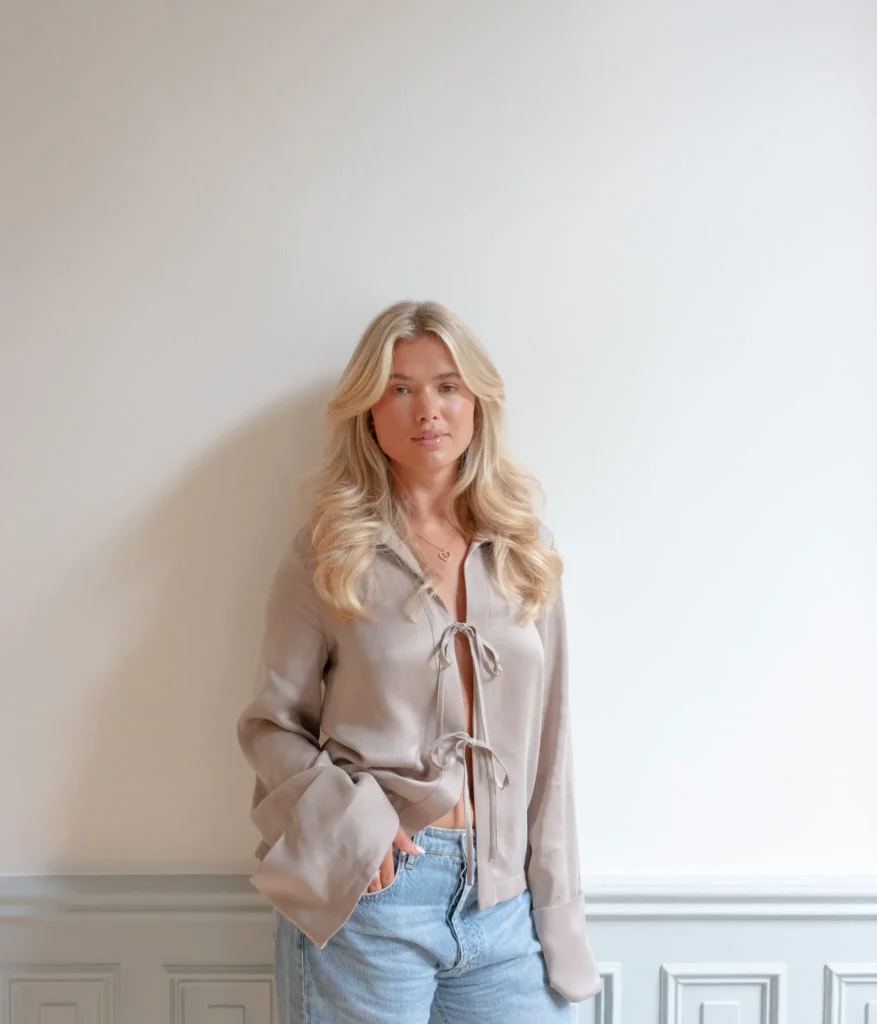 Matilda Djerf speaking on camera against a minimalistic backdrop, addressing workplace culture concerns at Djerf Avenue