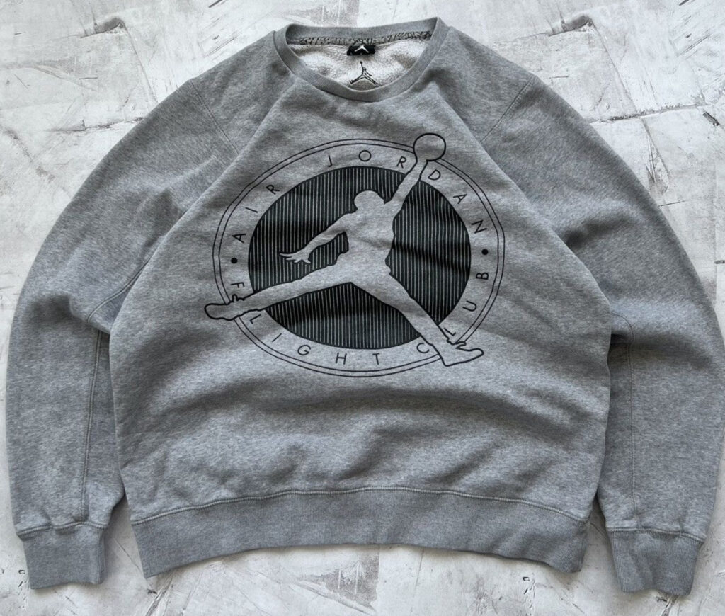 A vintage Nike spellout Jordan crewneck sweatshirt featuring bold “Nike” lettering across the chest with a classic oversized fit