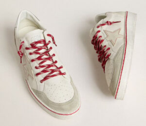 Golden Goose Women’s Ball Star LTD CNY sneakers in white leather with red and gold accents and a vintage-inspired design