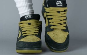 On-foot look at the Supreme x Nike SB Dunk Low “Camper Green” featuring bold green and black design with Supreme branding