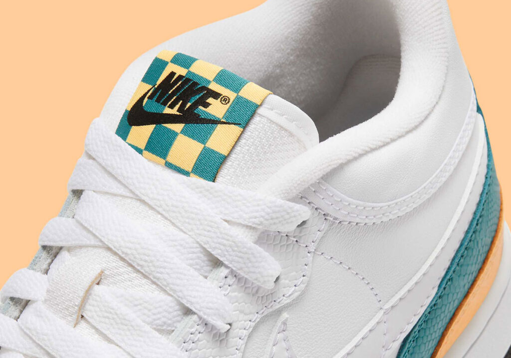 Nike Mac Attack “Year of the Snake” sneakers featuring faux snakeskin texture, gold accents, and premium leather overlays