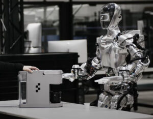 A humanoid robot folding laundry and preparing coffee in a modern kitchen, showcasing advanced AI and home automation capabilities