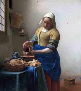 Johannes Vermeer’s The Milkmaid, a domestic scene featuring a maid pouring milk, illuminated by soft natural light