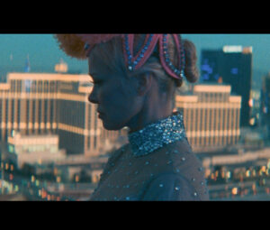 Miley Cyrus performing “Beautiful That Way” with a cinematic backdrop, showcasing her emotional and vocal depth