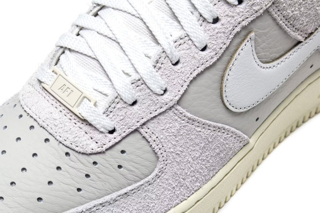 Discover the Nike Air Force 1 Low “Phantom” and “Light Bone,” featuring hairy suede, textured leather, and ghostly tones