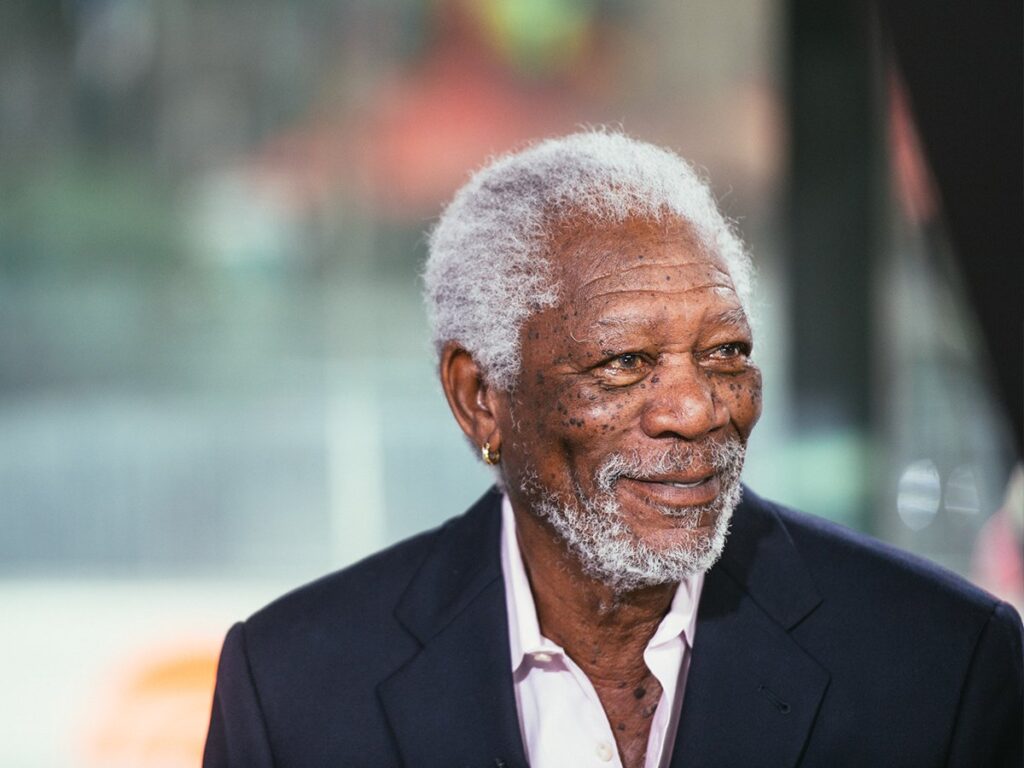 Morgan Freeman at a film premiere, expressing his passion for playing a historically significant character in a future biopic