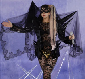 Lady Gaga performing Good Morning in a vintage-inspired setting, showcasing her artistic reinvention and vocal mastery