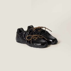 Miu Miu New Balance 530 sneaker in black patent leather, featuring a squashed sole, tripled-up laces, and luxurious design