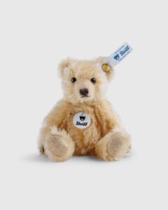 Steiff Classic Teddy Bear made of premium mohair, featuring hand-embroidered details, glass eyes, and the iconic Button in Ear