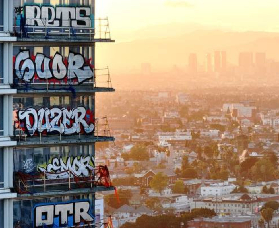 Graffiti-covered floors of the abandoned Oceanwide Plaza in Los Angeles, showcasing vibrant street art and urban decay