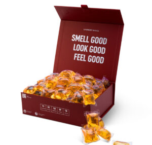 Luxury Laundry Sauce Detergent Pods with premium fragrances like Italian Bergamot and Siberian Pine on a stylish countertop