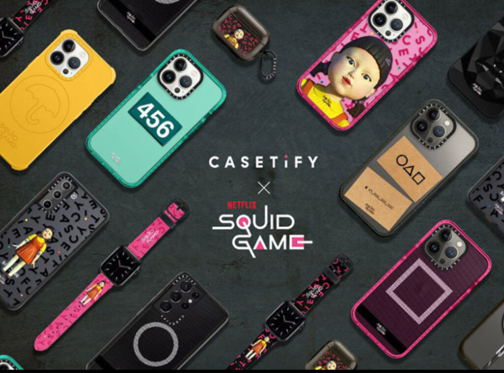 A phone case from the CASETiFY Squid Game collection, featuring the iconic circle, triangle, and square guard symbols