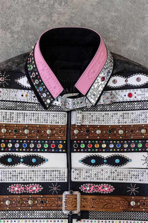 A close-up view of Mattias Gollin’s Replica Suit, crafted from vintage belts, showcasing intricate details and textures