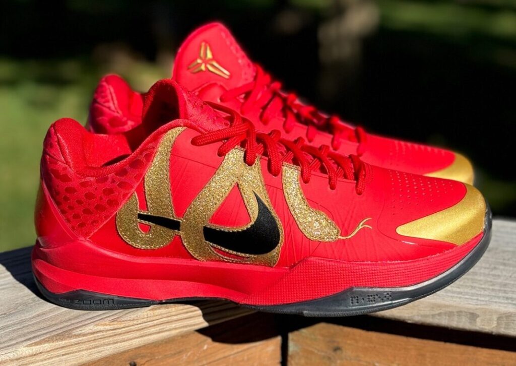 Stylish Kobe Bryant sneakers with intricate design and gold accents