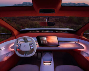 A BMW Panoramic iDrive Head-Up Display showcasing AR navigation, speed, and safety features on a wide windshield interface