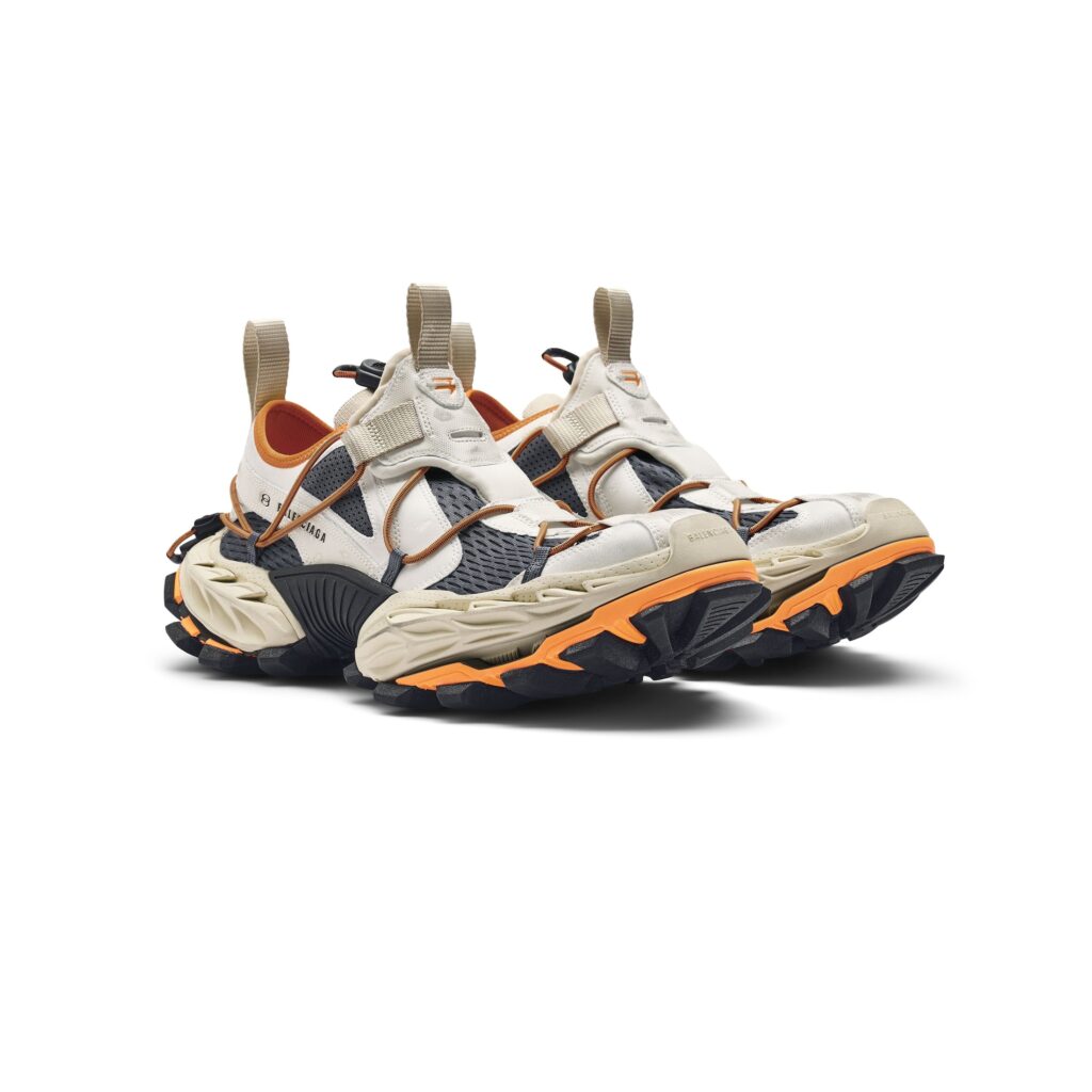A bold Balenciaga rugged sneaker featuring durable materials, chunky soles, and outdoor-inspired design elements