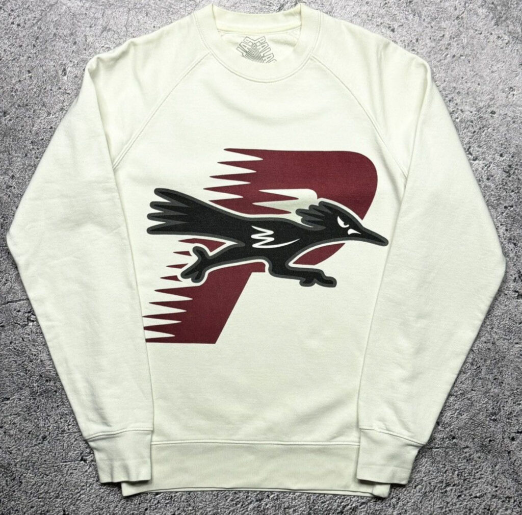 Palace Roadrunner sweatshirt featuring a bold graphic of Roadrunner mid-sprint with Palace branding, a streetwear staple