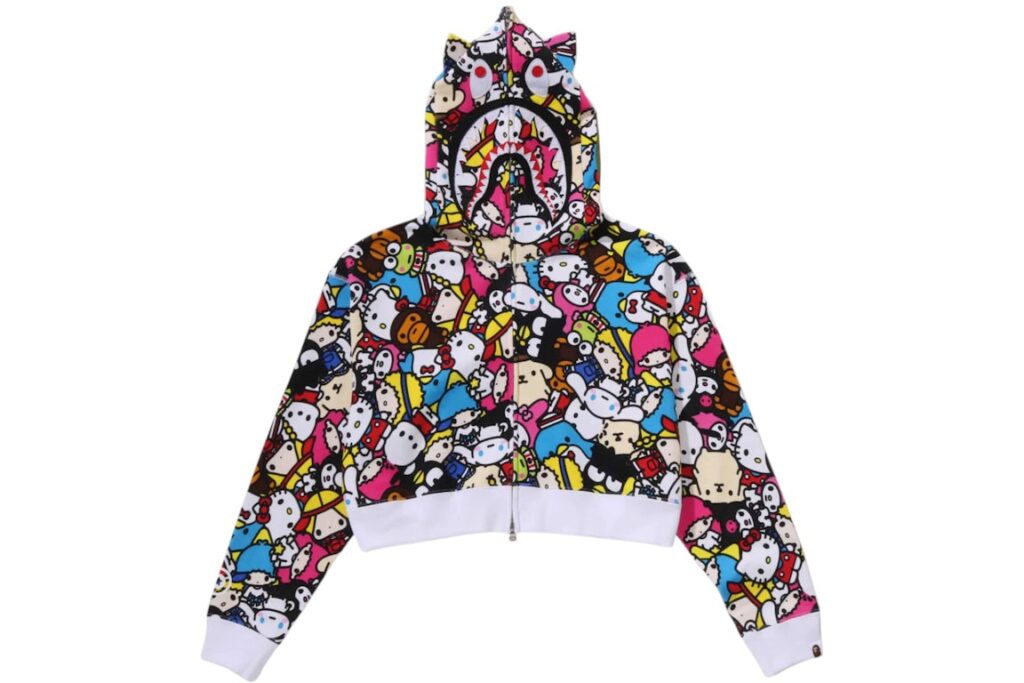A cropped BAPE x Sanrio Baby Milo Shark Hoodie featuring Hello Kitty, My Melody, and bold Shark motif in vibrant colors