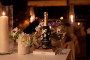 A beautifully set dining table at Perrier-Jouët’s Banquet of Nature, adorned with floral arrangements and Perrier-Jouët champagne