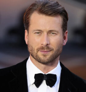 A portrait of Glen Powell, showcasing his charismatic presence and versatility as an actor in Hollywood’s evolving entertainment landscape