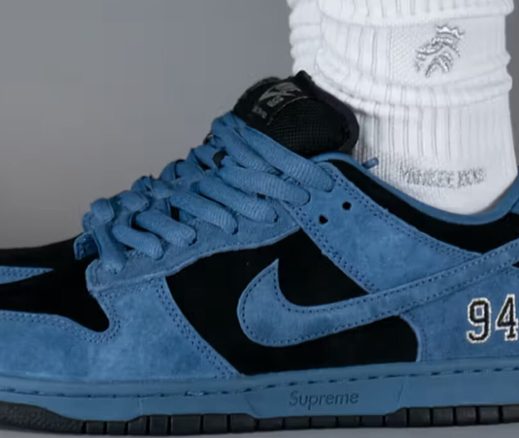 A close-up of the Supreme x Nike SB Dunk Low “Ocean Fog,” showcasing its ocean-inspired blue hues and premium materials