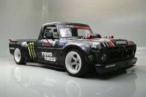 Ken Block’s 1977 Ford F-150 Hoonitruck displayed at Barrett-Jackson, showcasing its custom design and powerful stance