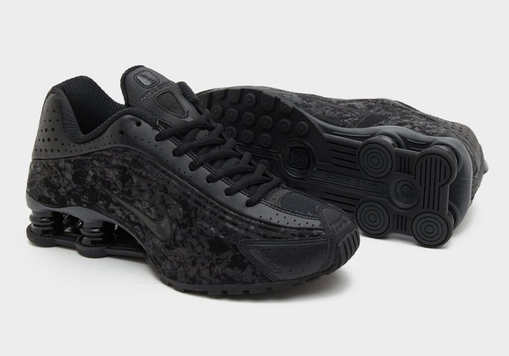 Nike Shox R4 Black Flora sneakers featuring a sleek black base with vibrant floral patterns and innovative cushioning
