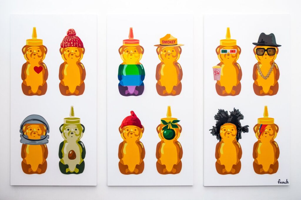 A colorful painted honey bear sculpture displayed at the City Museum in St. Louis, blending street art with museum culture