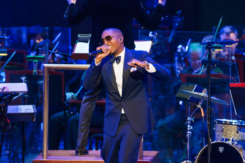 Nas performing live with the Las Vegas Philharmonic at Encore Theater, blending hip-hop storytelling with orchestral sounds