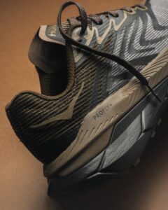 HOKA Tech Stealth Collection shoes featuring snake-scale patterns, metallic accents, and performance-focused design