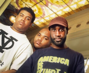 A portrait of De La Soul, the iconic hip-hop trio, showcasing their unique style and influence in alternative hip-hop music