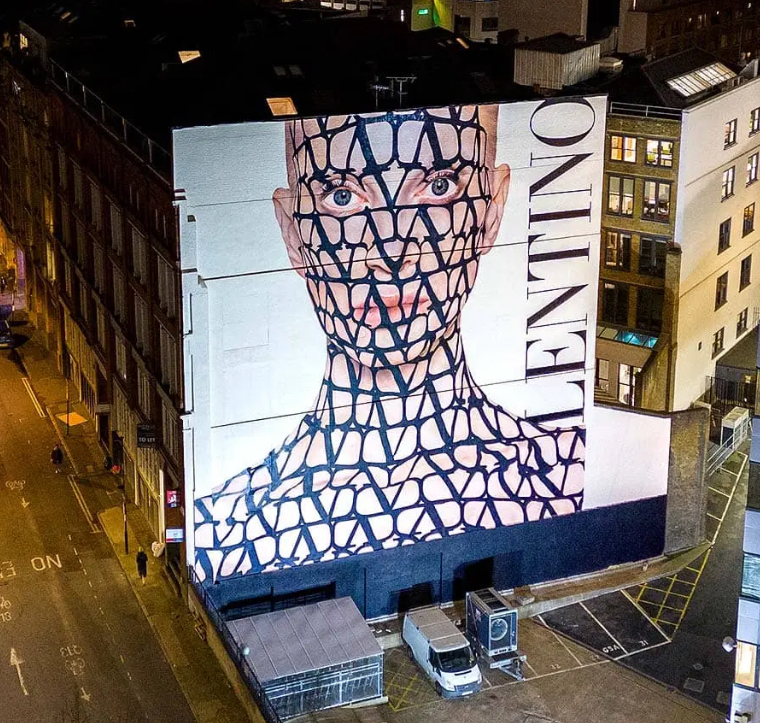 Valentino’s Toile Iconographe print painted on Kristen McMenamy’s skin, showcasing a bold blend of fashion and art