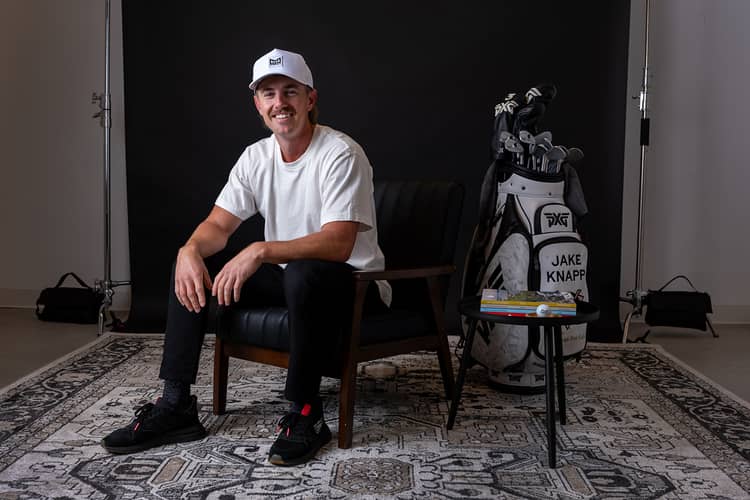Jake Knapp, professional golfer and new Melin ambassador, showcasing premium headwear during a golf event