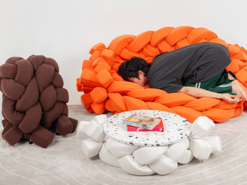 The YYYarn Collection features a braided sofa, table, and stool, blending woven artistry with modern elegance and versatility